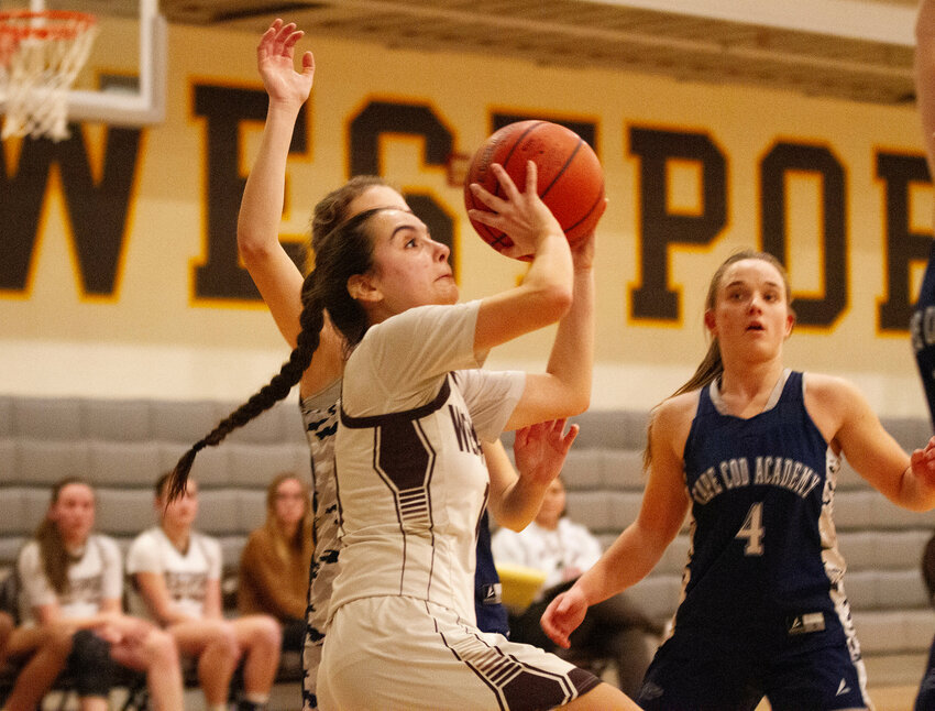 Julia George drives to the hoop during the Wildcats' 60-30 crushing of Cape Cod Academy in a home game on Tuesday night. George, the team's point guard, scored 14 points in games against Cape Cod and Fairhaven last week. She also had 13 rebounds, 6 steals, and 10 assists.