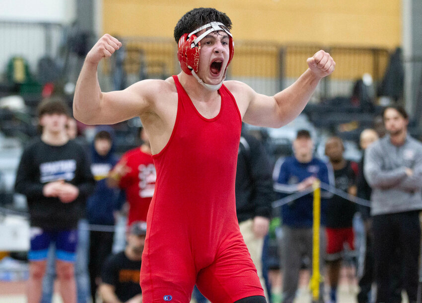Baha Akdemir reacts to his victory in the semifinals of the 165 pound weight class during the 2024 state championship meet Saturday, Feb. 24, in Providence.