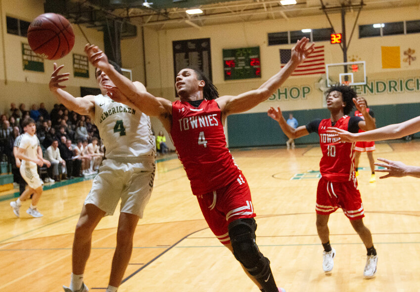 East Providence High School's Levi Jacobs reaches for a rebound against a Hendricken opponent during the teams' Division I boys' basketball playoff game Tuesday, Feb. 27, in Warwick.