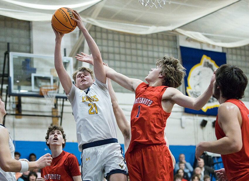 Evan Anderson pulls down an offensive rebound during the first half of Tuesday's Division I quarterfinals.
