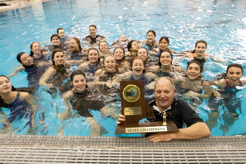 The Barrington High School girls swim team and its coach Sandy Gorham celebrate the Eagles&rsquo; 10th straight state championship.
