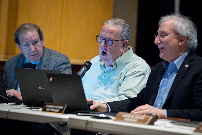 Council members J. Mark Ryan, Charles Levesque, and Leonard Katzman (from left) at a hearing on the East Main Road roundabout proposal in December 2023 at Portsmouth High School. Levesque said at that meetings and several others at PHS, the disconnect between the council and many residents became clear. &ldquo;Through most of the public hearings, it was apparent to me that there was a real division between what the town felt it was putting out and what the people felt they were hearing,&rdquo; he said.