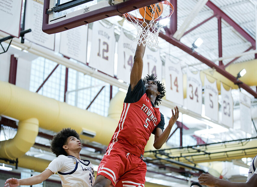East Providence's Kenaz Ochgwu puts in two of his team-best 25 points for the Townies in their Boys' Open State Basketball Tournament loss to top-seeded Classical Monday night, March 11, at Rhode Island College.