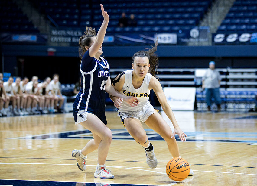 Maddie Gill drives toward the hoop early in the first half of the girls State Finals, Sunday.