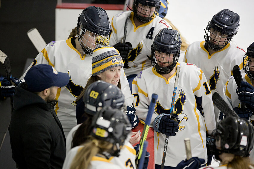East Bay girls' hockey co-op head coach Brie Rondeau talks to the Eagles during a break in their 2024 state playoff game against LaSalle March 1 in Portsmouth.