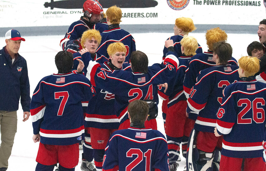 Chase Pascoe (middle) and the yellow headed Patriots celebrate after the beat BVS 6-2 to win the Division II State Championship at Schneider Arena on Sunday.&nbsp;