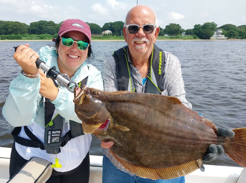 Shaina Boyle and Gary Vandemoortele, Smithfield, with a 27&rdquo; summer flounder caught fishing with Capt. Dave Monti. Monti&rsquo;s seminar is Monday, March 25.