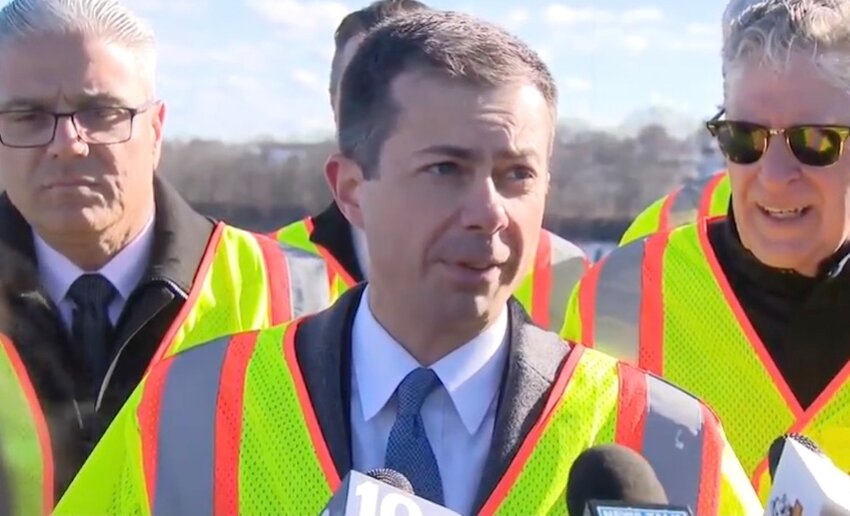 Transportation Secretary Pete Buttigieg talks to the assembled media after touring the Washington Bridge with local officials Tuesday morning, March 19.