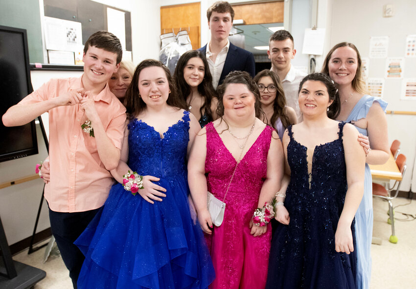 Brenden Baptista, Life Skills Teaching Assistant Michelle Costa, next in blue dress is Zoie Almeida, next in back row behind Zoie is Sarah Souza, tall boy in back is Jason Potvin, boy in back with white shirt is Ben Troia, girl in pink dress in front is Brooke Bergeron, next in purple dress is Kassidi Tolan, next in dark blue dress is Kyra McCarty, women on right end is Life Skills Special Education Teacher Allison LeBel.