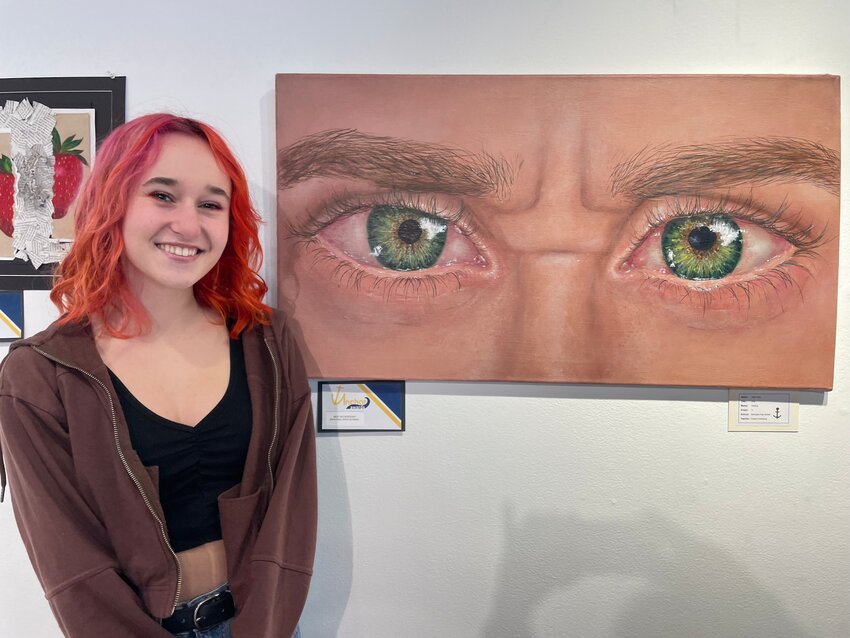 BHS student Eden White stands beside her painting &quot;Why?&quot; The painting was selected for a Best In Category Award.