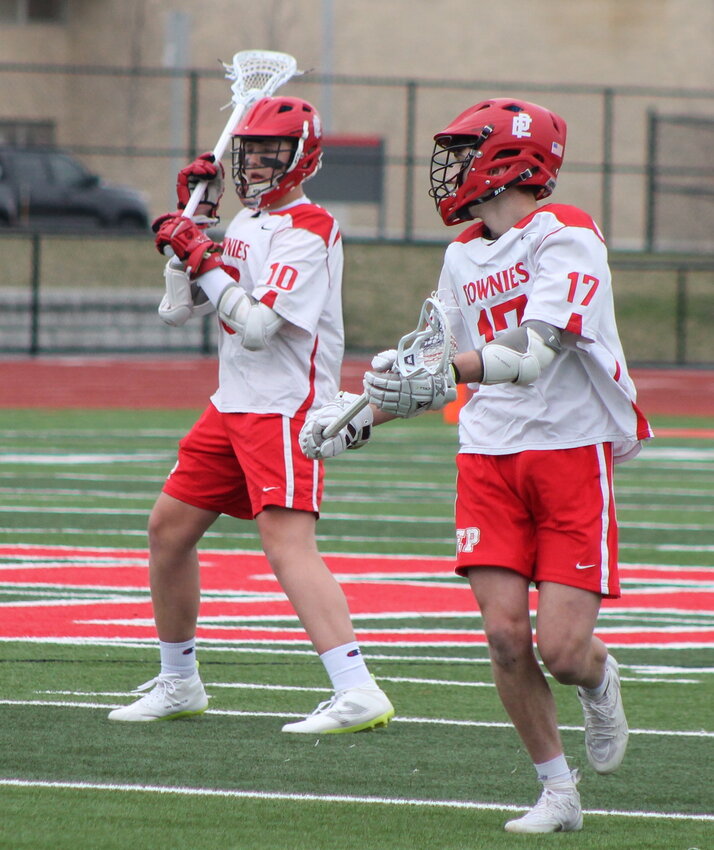 Keegan Grant (left) scored four goals in two games for the EPHS boys' lacrosse team to open the 2024 season, including a hat trick against Cranston West in the Townies' 14-4 victory.