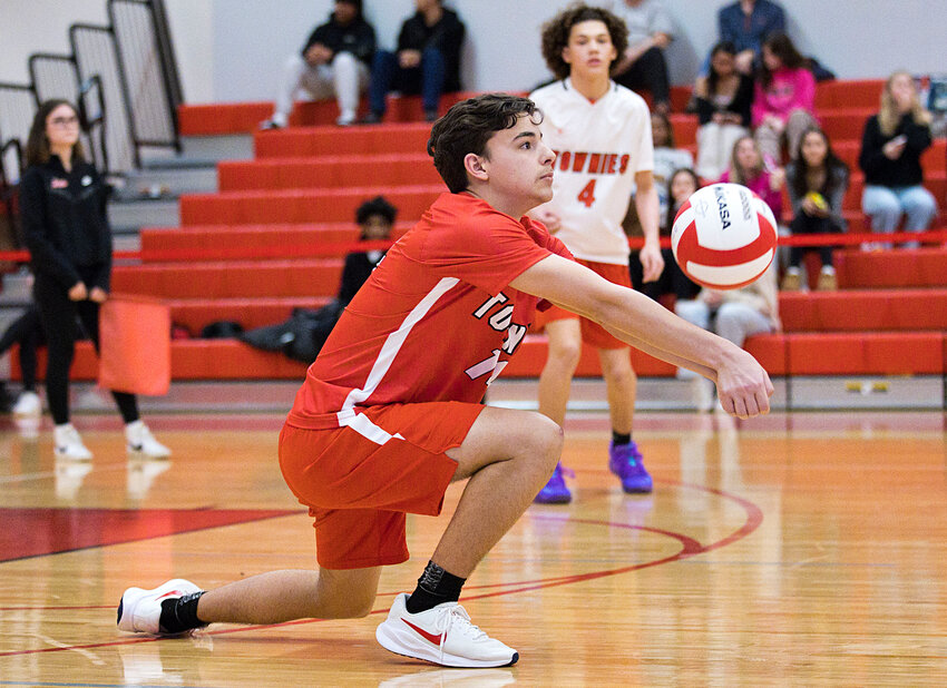 East Providence High School's Logan Calouro digs a shot from a Pawtucket co-op player in the teams' non-league boys' volleyball 2024 season opener March 28.