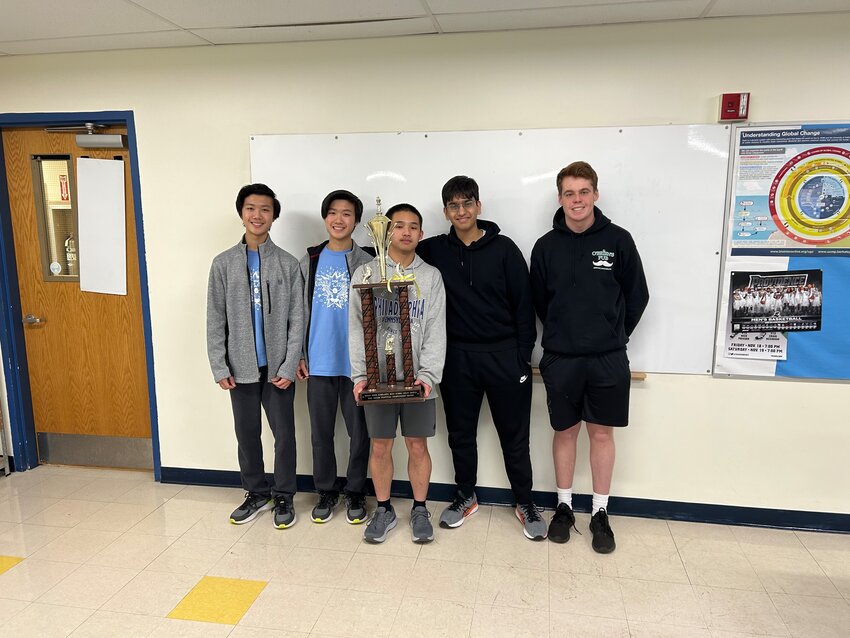 Members of the Barrington High School chess team show off their trophy after winning the state championship. Pictured are team members Andrew Li, Robert Li, Levon He, Sid Gupta and Connor Marley (from left to right).