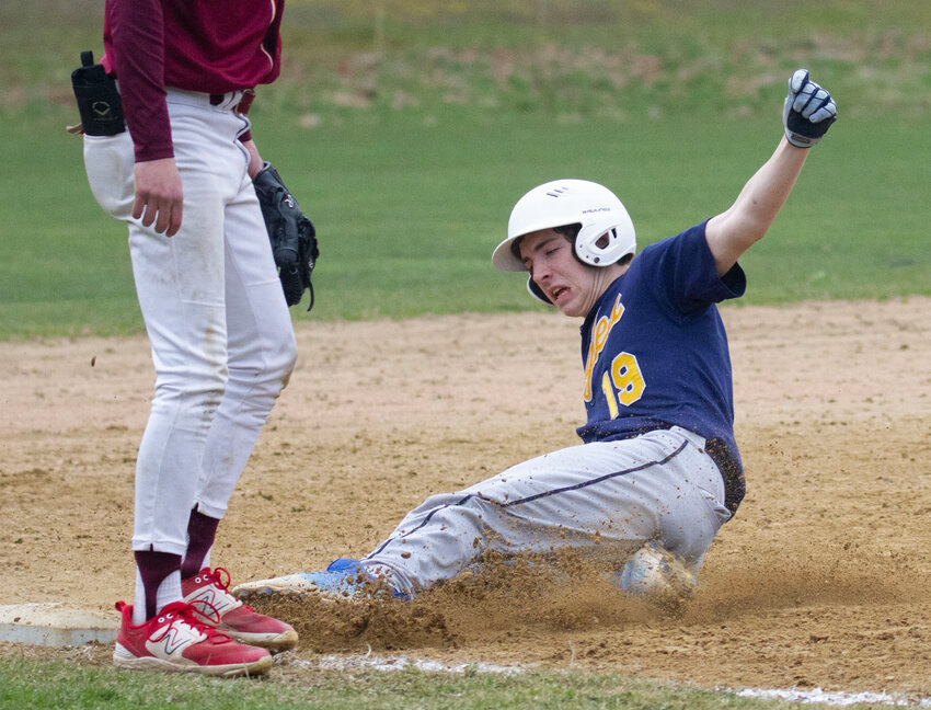 Lucas Tanous, shown sliding safely into third base during a previous Barrington game, drove in two runs against Chariho.
