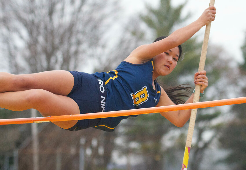 Barrington High School's Siena Leland clears the bar while competing in the pole vault at a recent track meet.