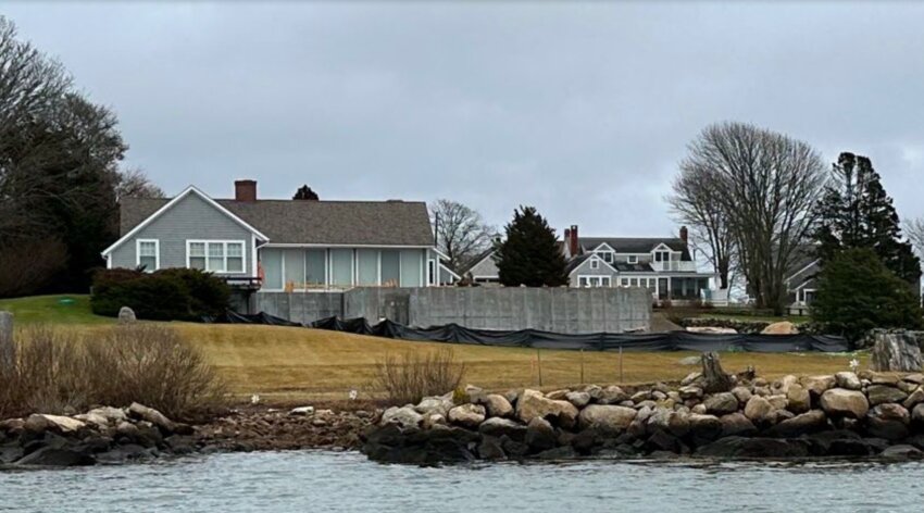 A photograph included in the neighbors' motion to intervene shows the structure visible from the water.