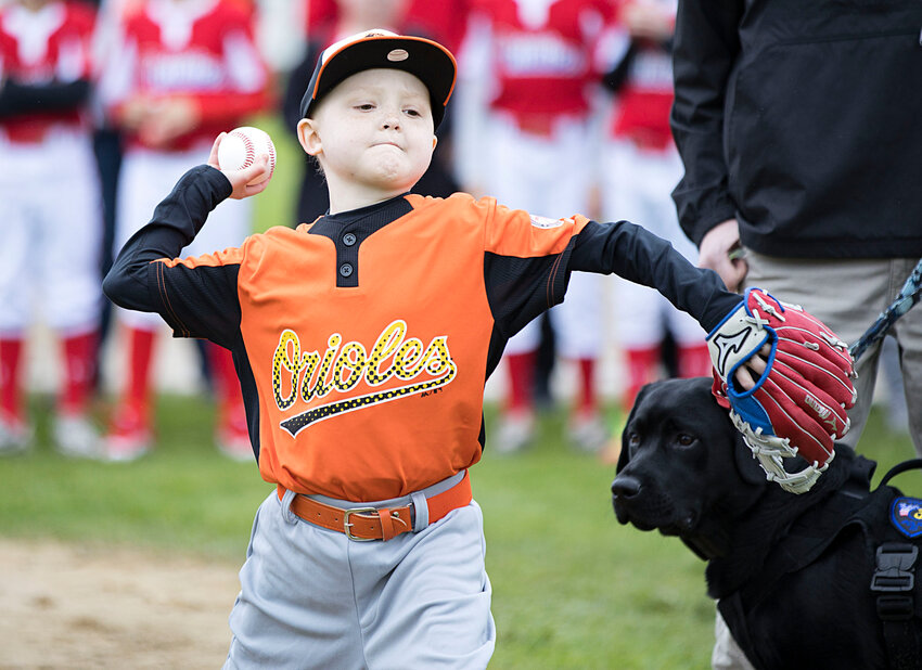 Liam Chapman throws out the first pitch at Tiverton Baseball's opening day ceremonies at the Tiverton Town Farm.