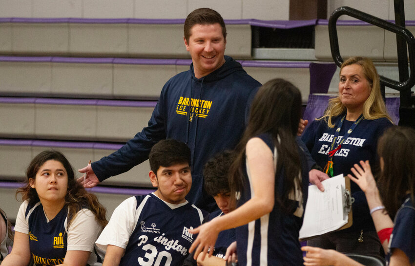 Coach Jacob Kapstein speaks with members of the BHS Unified Basketball team during a recent game at Mt. Hope High School. Kapstein is busy all three seasons &mdash; he&rsquo;s an assistant coach with the football team in the fall, head coach of the BHS boys hockey team in the winter, and head coach of the Unified Basketball team in the spring.