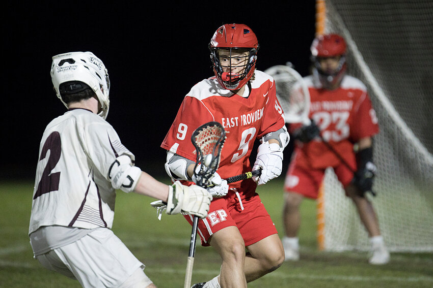 East Providence High School's Samuel Jackson defends against an opponent from Tiverton during the teams' Division IV boys' lacrosse contest April 24.
