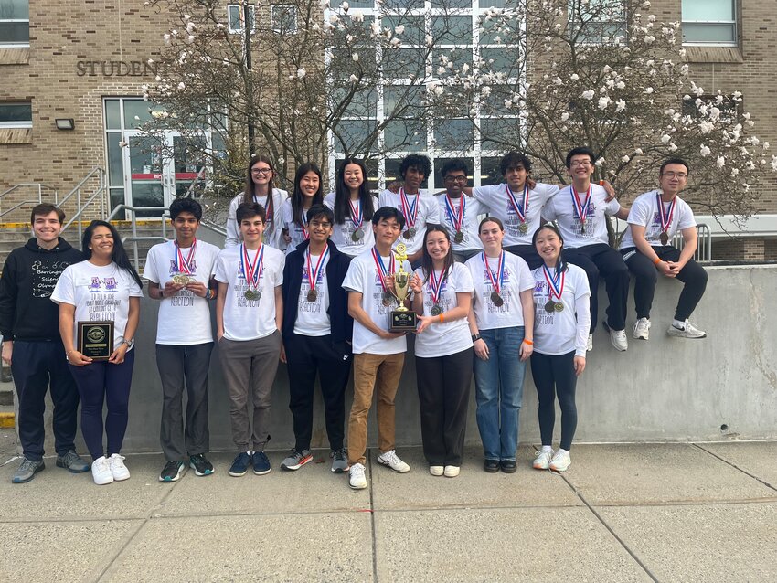 Members of the Barrington High School Science Olympiad team pose for a photo after winning the state championship. Pictured are (back row, left to right) Genevieve Geiser, Athena Gao, Michelle Xian, Vineet Abbineni, Vignesh Peddi, Rahul Yehiya, Troy Tian, Alan Weng, and (front row, left to right) Coach Stephen Marshall, Coach Sabrina Cancel, Neal Bansal, Will Sturla, Siddarth Gupta, David Xiong, Isabelle Chen, Ellie Dunn, and Iris Yang. BHS will compete in nationals on May 23-24.