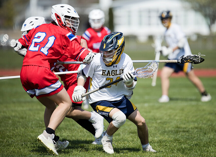 Nick Spaight (right), shown in a game earlier this season, scored once and assisted on four other goals during the Eagles' 12-8 win over Mount St. Charles.