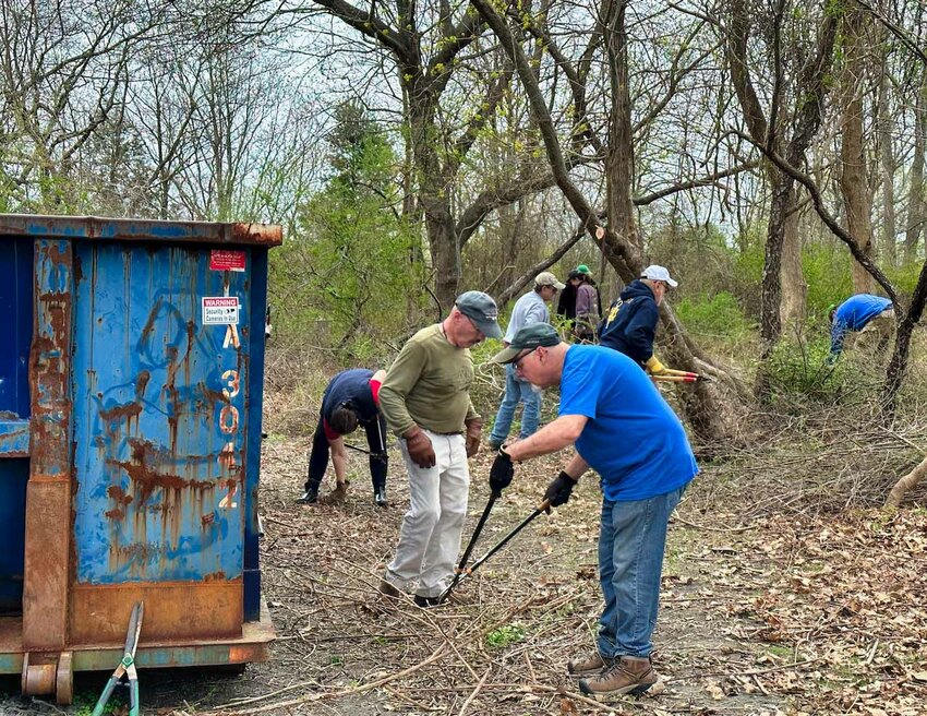 Volunteers clean up the grounds at Butts Hill Fort. The Battle of Rhode Island Association was the recipient of a grant from the Aquidneck Land Trust for grounds restoration of the fort.
