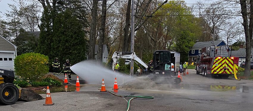 Barrington Firefighters spray water onto a gas main leak on Tiffany Circle on Thursday morning, May 2.