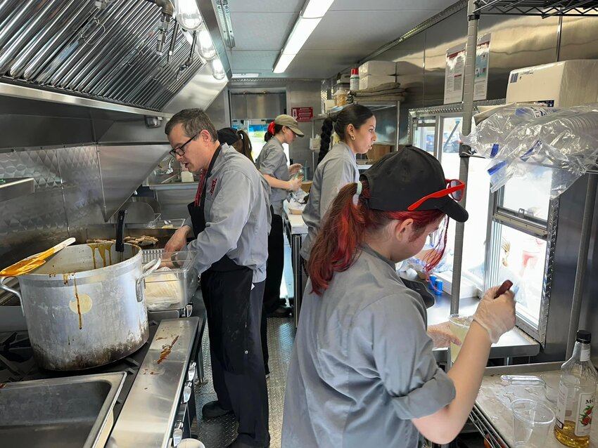 EPCTC Culinary Arts instructor Chef Bill Walker and his students prepare their item at the food truck event on May 4.