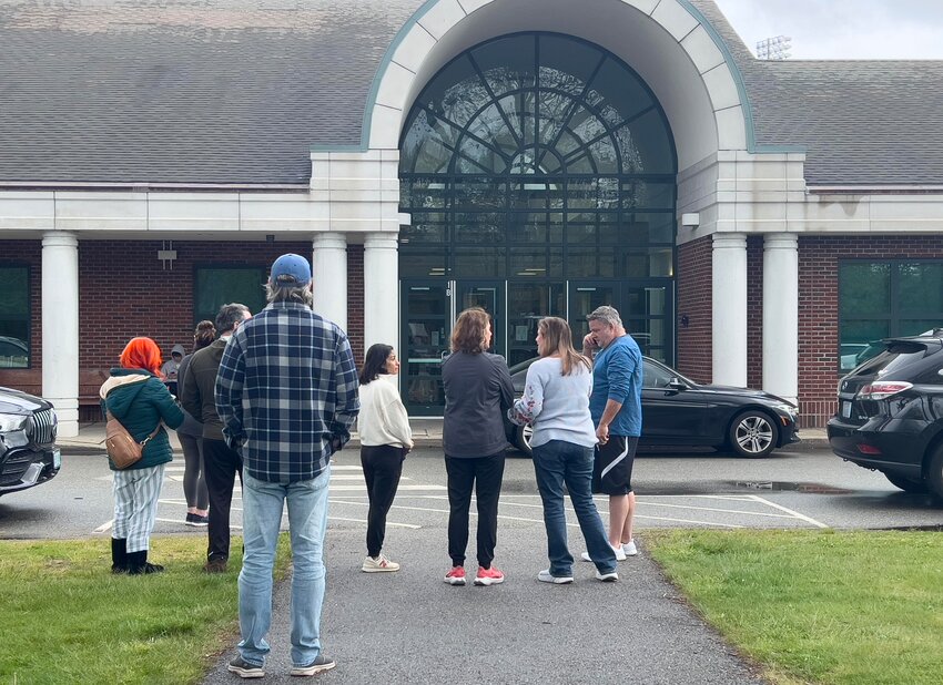 Parents gather outside Barrington High School during a lockdown on Friday morning, May 10.