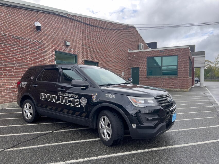 A Barrington Police cruiser is parked outside the high school on Friday morning, May 10.