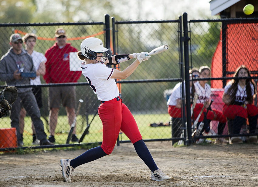Portsmouth High&rsquo;s Barbara Rainey blasts a hit to centerfield during the Patriots&rsquo; 12-1 win over Barrington on May 7.