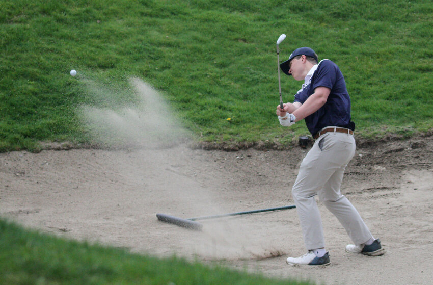 Barrington&rsquo;s Nolan Leonard, a senior member of the team, blasts out of a bunker of the 15th hole during a recent league match. The Eagles are competing in the state championship this week.