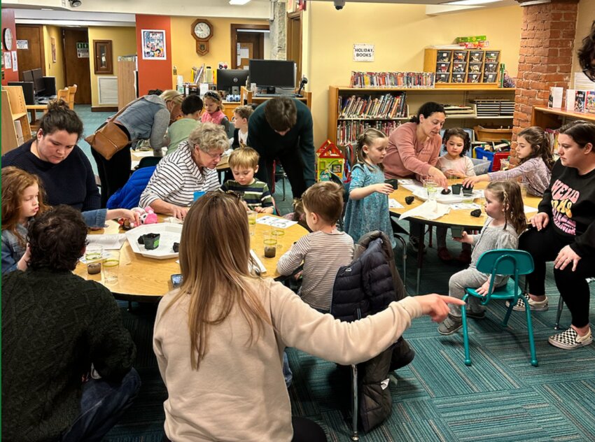 Preschool students gathered in the youth activity room at the George Hail Library in Warren to participate in a lesson crafted by Brown University students.