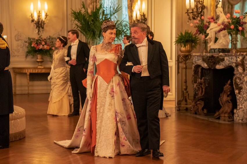 Bertha Russell (Carrie Coon) and Ward McAllister (Nathan Lane) stroll through The Elms Ballroom in a scene from &quot;The Gilded Age&quot; Season 2.