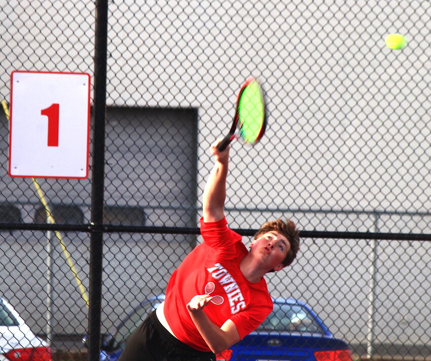 No. 1 singles player James McShane serves for the Townies during a recent EPHS boys' tennis match.