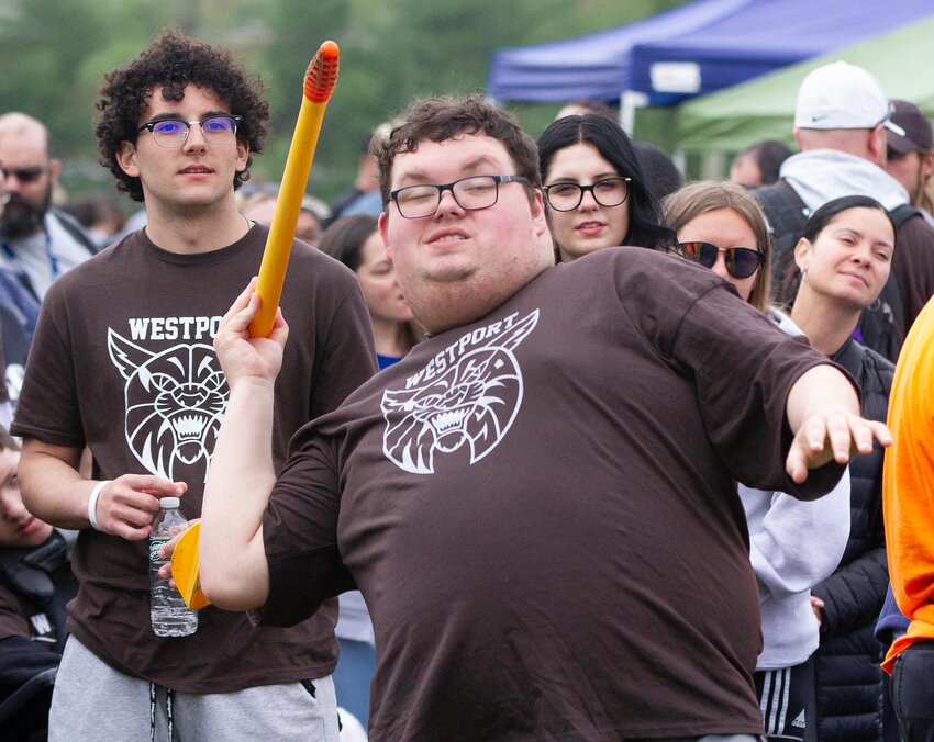 Partner Noah Amaral (left) looks on as Austin Carter heaves the javelin during the Special Olympic Games in Dartmouth on Monday.