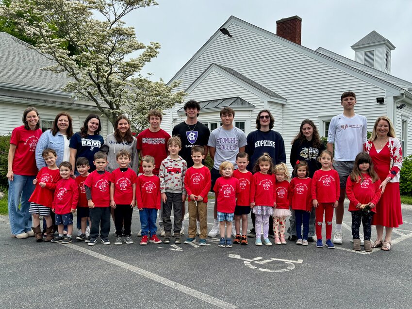 On Monday morning, eight Portsmouth High School seniors visited Portsmouth Nursery School, where they all &ldquo;graduated&rdquo; as 5-year-olds back in 2011. This year&rsquo;s class of nursery school students raised $270 toward the June 5 Post Prom event for the Class of 2024. Here, PHS seniors pose with PNS students and faculty. Starting with the third person from left in the back row, they are (from left) Gracin Raposa, Kayla Parsons, Oliver Tibbets, Nick Spaner, Matt Nolan, Colm Dooley, Claire Hook, and Cole Swider. They are all wearing shirts representing the colleges and universities they will be attending next fall. They are flanked by teacher&rsquo;s aid Kristie Labonte and head teacher Christy Renkawitz (left) and teacher&rsquo;s aide Caroline Dooley (right).