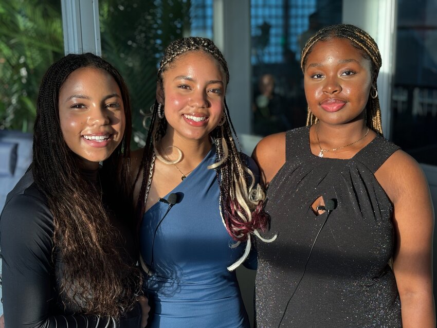 Keira and Makayla Boxell (left), seniors at Portsmouth High School, founded Shades of Knowledge along with Jully Myrthil (right) of Providence, to get representative literature into the hands of underserved communities in other countries. They hope to continue their literacy efforts in Rhode Island as well.