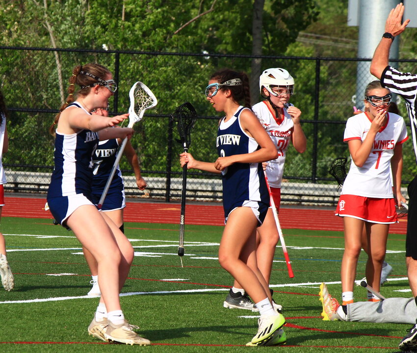 Maggie Lima (right) gets a hug from Bay View teammate Mackenna Buffery after she scored what proved the game-winning goal for the Bengals in their victory over East Providence in the Division III girls' lacrosse playoff quarterfinals Thursday, May 23.