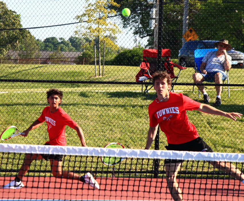 EP's Nathan Thurber poaches a shot at the net while doubles mate Jordan O'Hara races to cover for the Townies during their 2024 Division II quarterfinal playoff match against Prout Friday, May 24. EP won the overall contest 4-0 to advance to the semis.