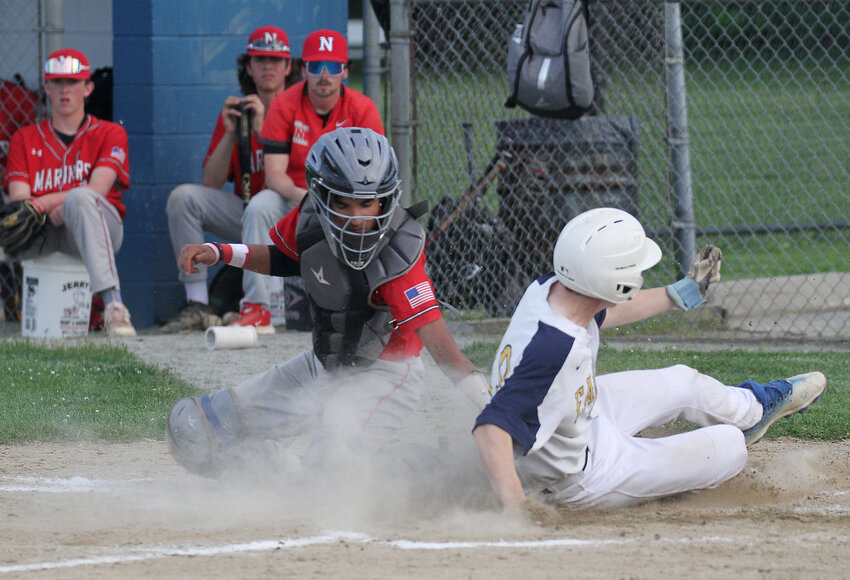 Luke Tanous slides safely into home during the Eagles' 5-0 win over Narragansett on Tuesday.