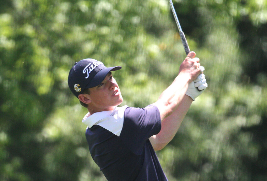 Barrington's Adam Gorman watches a shot during the first day of the golf state championship at Cranston Country Club.
