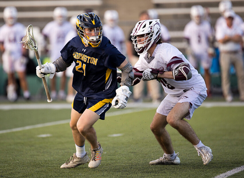 Quinn McNamara looks for an opportunity while pressured by a LaSalle defender.