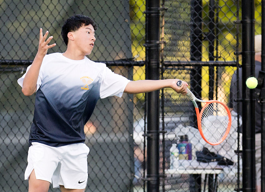 Number three doubles player Justin Kuo strikes a forehand during the state championship match on Saturday.