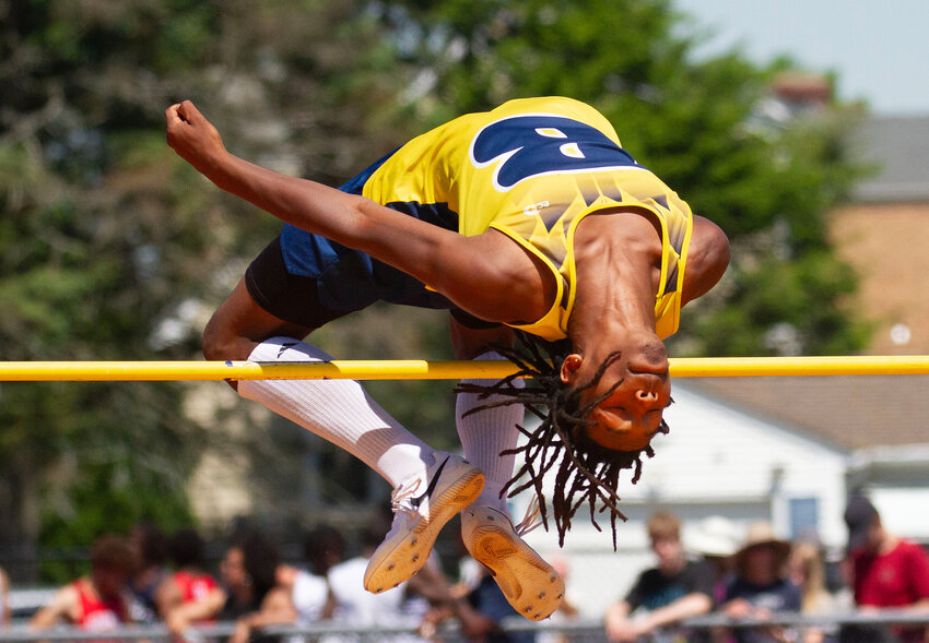 Barrington's Chucky Potter competes in the high jump at states.