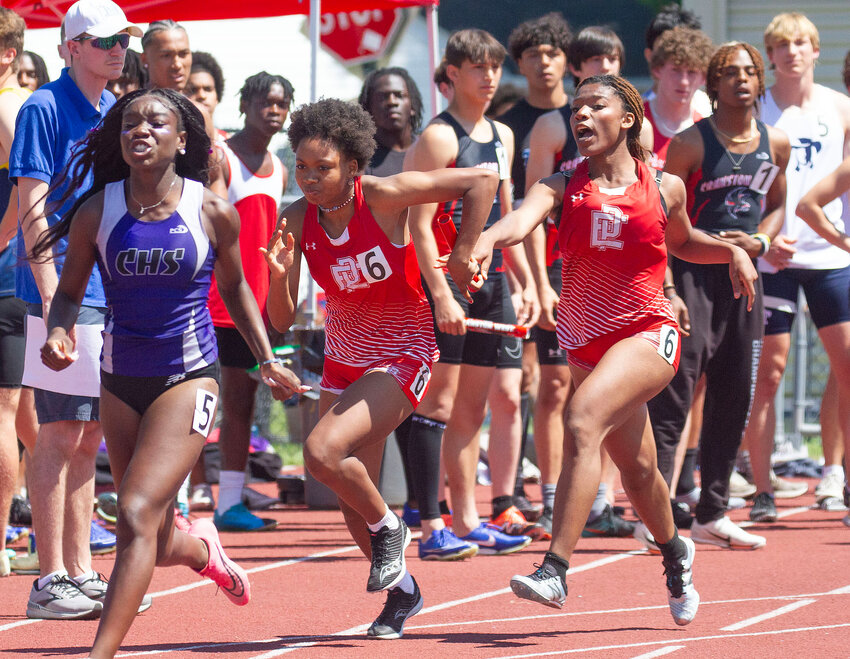 Nazarae Phillip takes the baton from teammate Kandace Daniel for the EPHS girls' 4x100 meter relay quartet at the 2024 state meet.