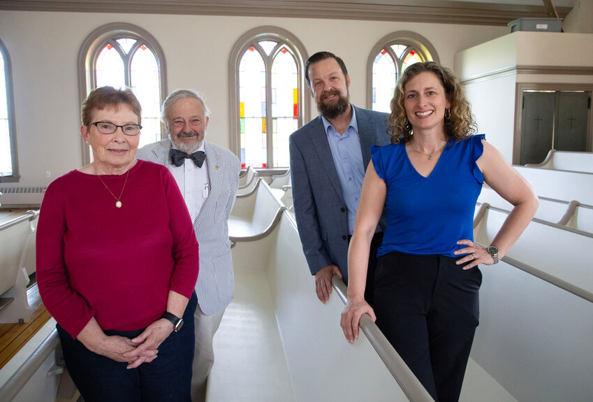 (L-r) Historian Gail Feather,  Treasurer Tuffy Sanford, Pastor Jake McGuire, Rachel McGuire inside the newly rehabilitated, freshly painted sanctuary.