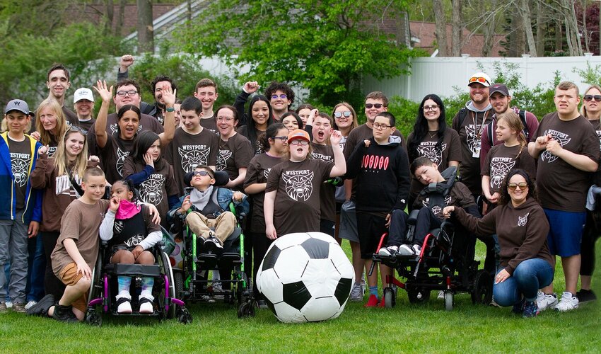 Students, teachers and supporters pose for a photo with middle and high school athletes at the recent Special Olympics regional meet held at Dartmouth High School.
