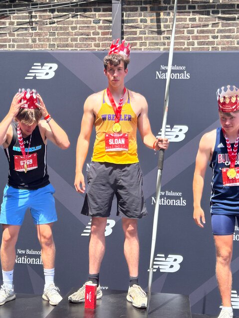 Barrington resident Scott Sloan (center) won the javelin event at the New Balance Nationals Outdoor earlier this month.