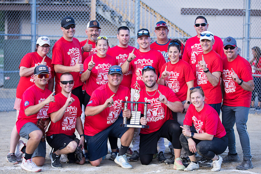Bristol firefighters pose with their trophy after winning the 2nd annual Battle of the Badges last Tuesday.